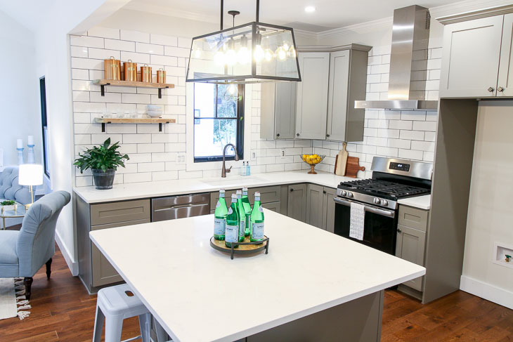 Beautiful modern farmhouse reclaimed open shelves subway tiles and carrara quartz countertops