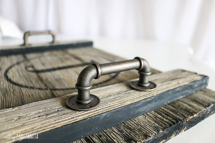 Industrial pipe handles on serving tray