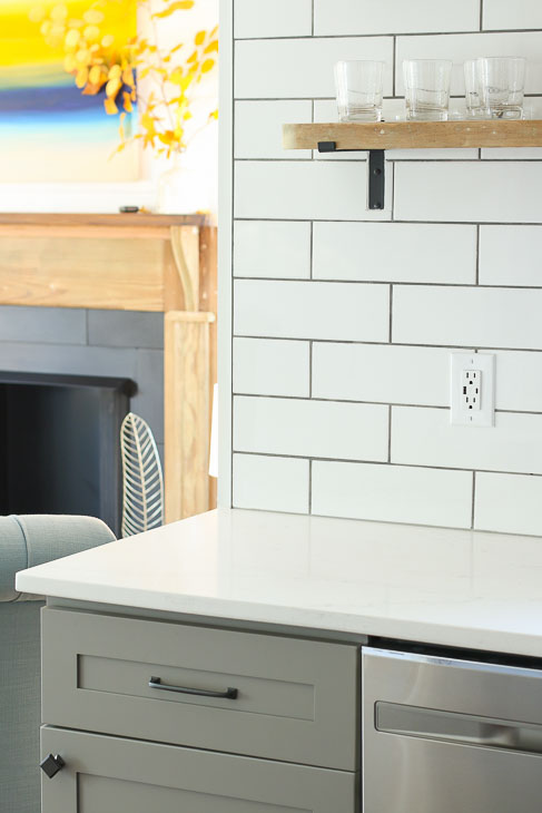 White subway backsplash open reclaimed wood shelving