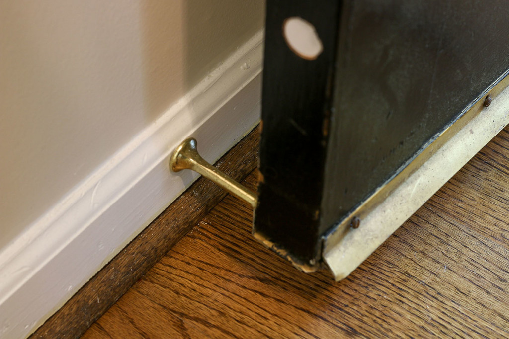 door stop behind door at baseboard