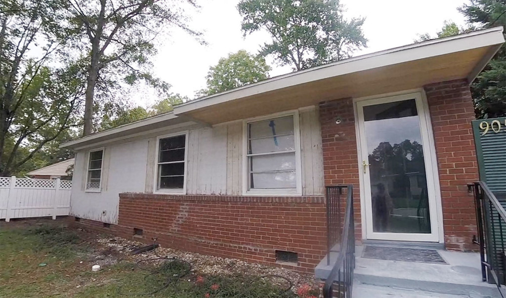 removed-old-siding to reveal wood siding white and brick front house