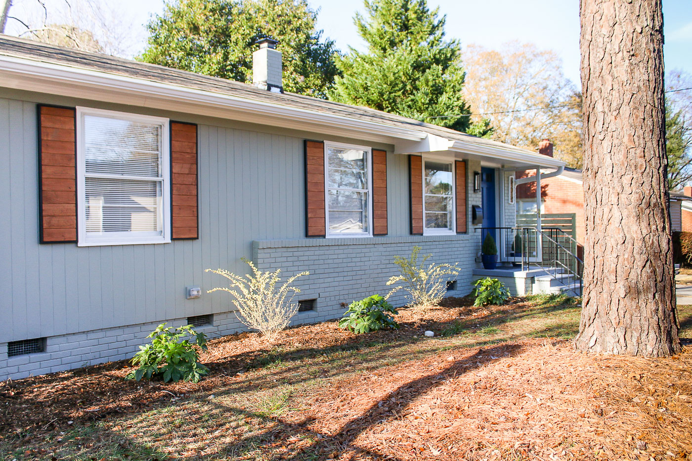 1905's ranch with modern wood shutters