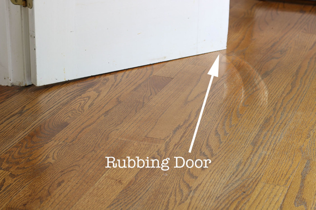 door scraping floor