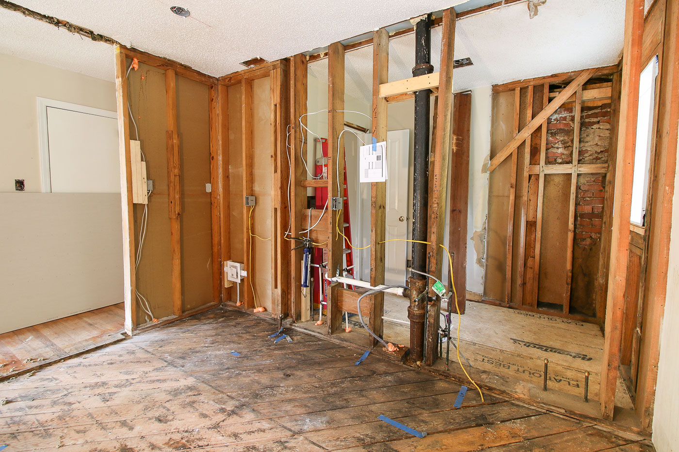 framing opening and plumbing run between kitchen bathroom